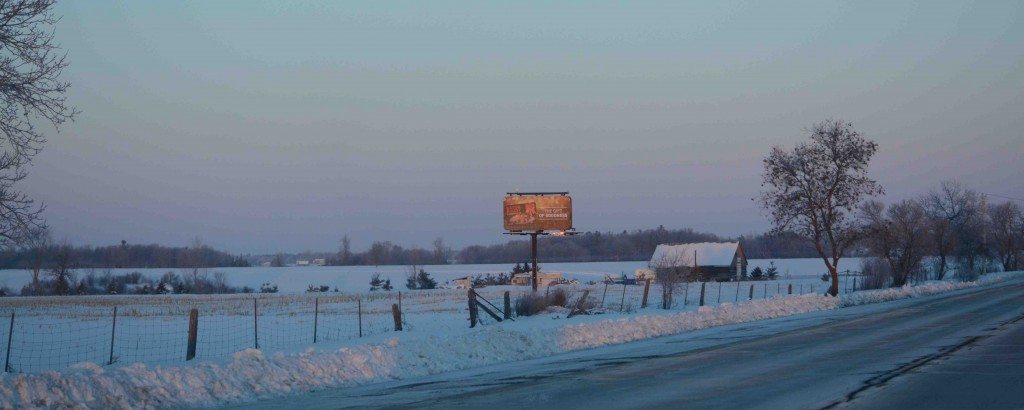 Look carefully -- the white bump on the billboard is Baltimore, on a frigid daybreak in southern Ontario. (©Dan and Patricia Lafortune)